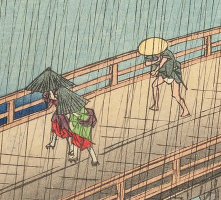 右の一枚の同じ範囲の拡大。相合傘の二人の着物には萌黄が入り、紅は鮮やかな朱、上着は紫がかっている。奥を歩く人物の笠ははっきりした黄色。橋板は淡い砂色